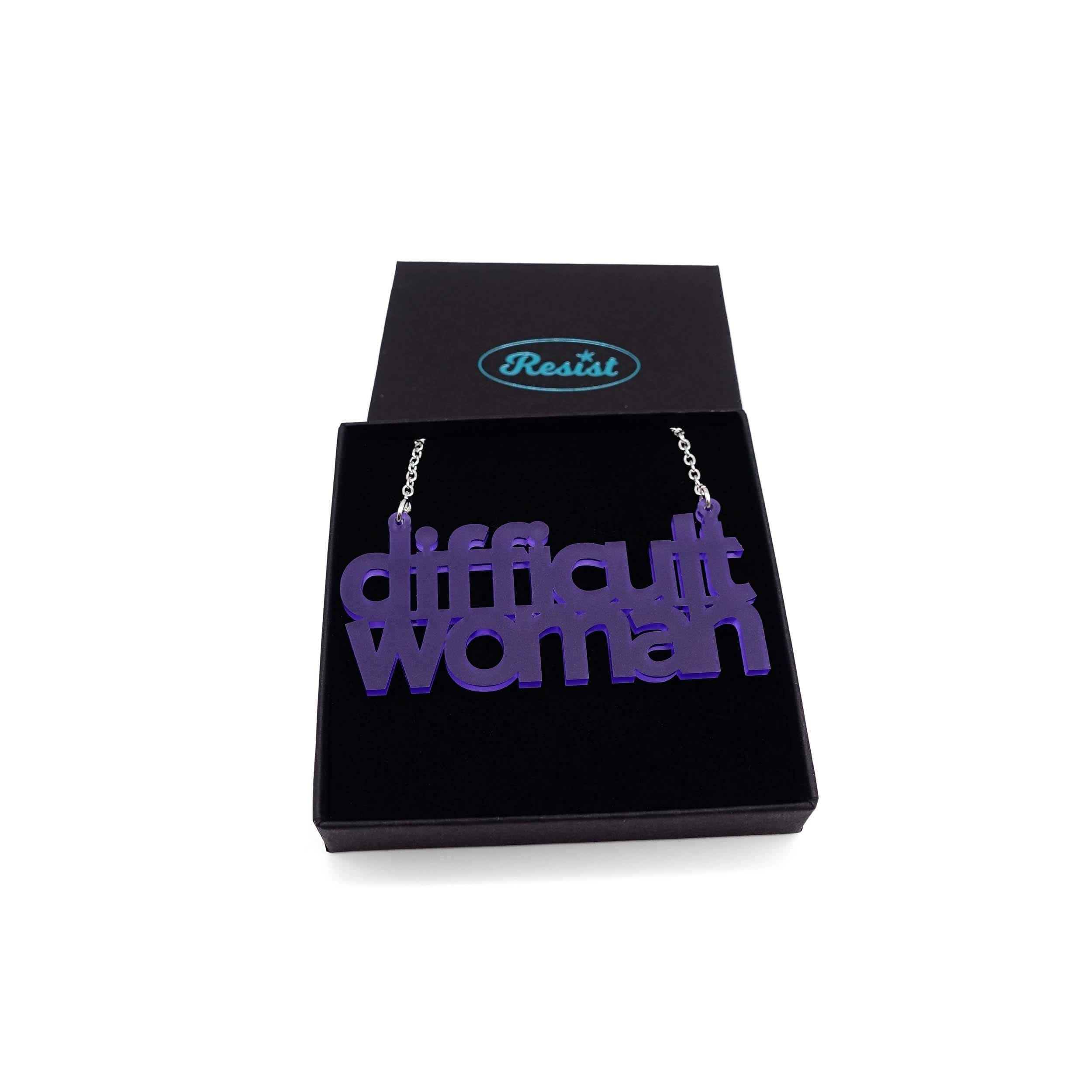 Difficult Woman necklace in violet frost, shown in a Wear and Resist gift box.