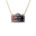 a necklace etched with 'what fresh hell is this?' shown hanging on a gold ion plated stainless steel chain. 