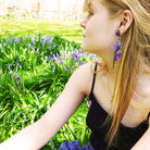 Model wears bluebell earrings by Sarah Day for Wear and Resist. 