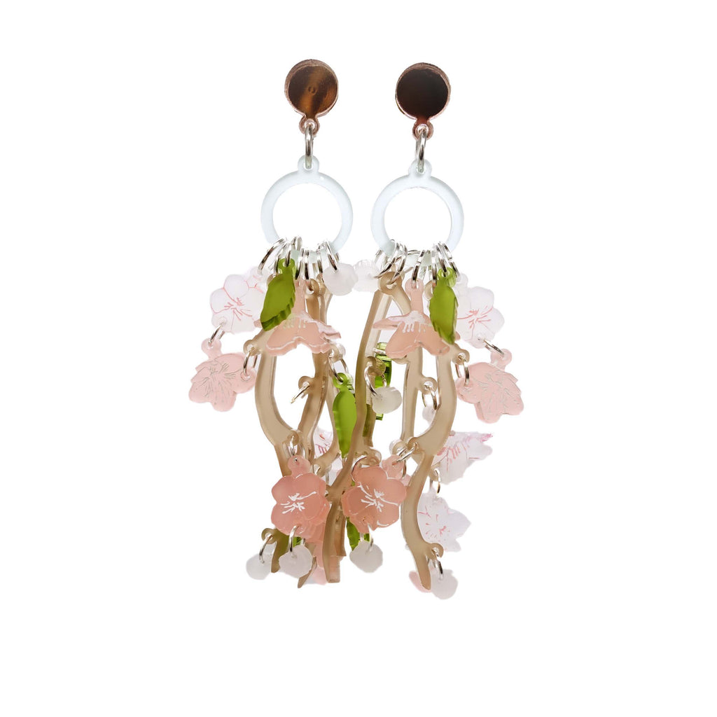 Cherry Blossom limited edition statement earrings designed by Sarah Day for Wear and Resist shown hanging cut out on a white background. . 