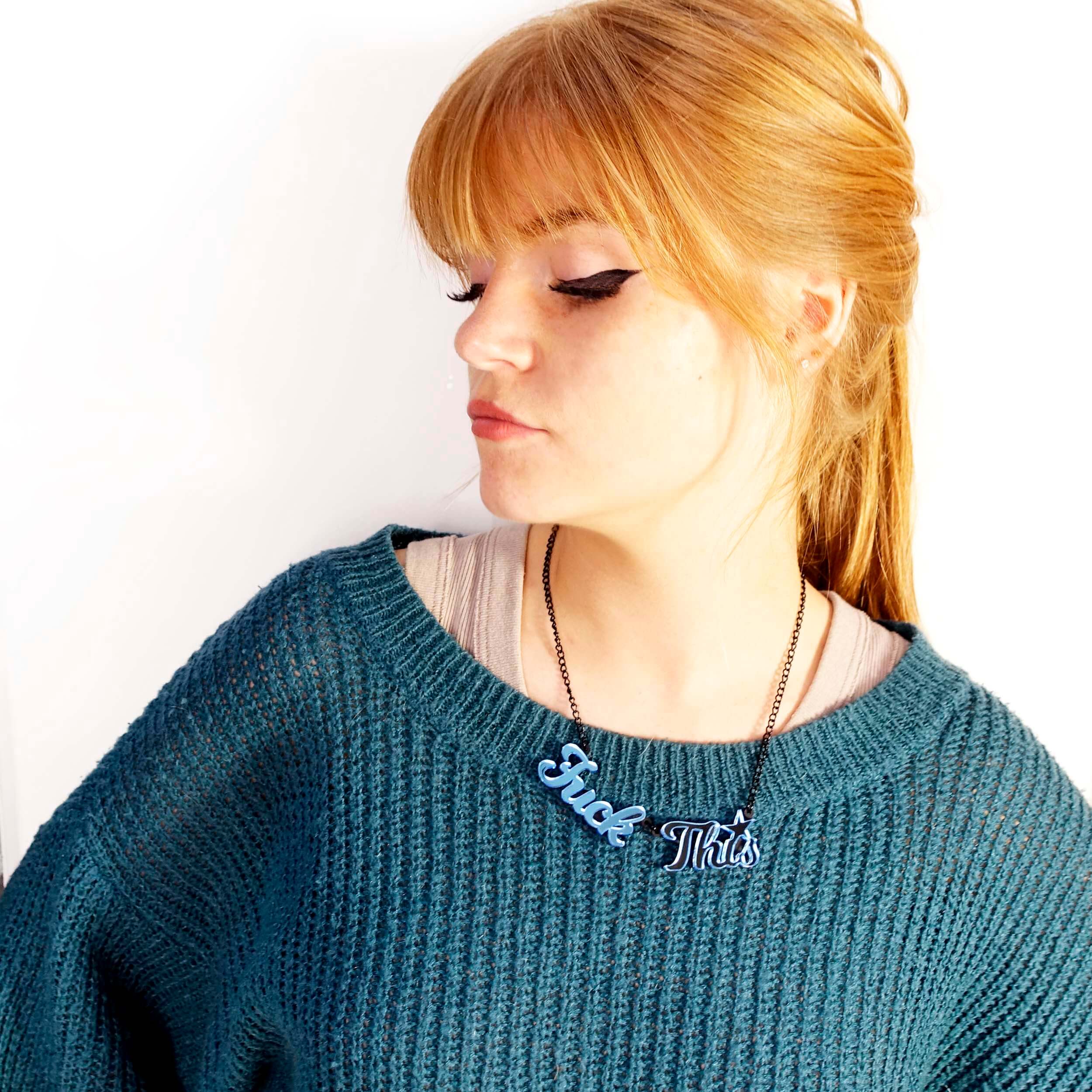 Eliza wears a Sky blue mirror F*ck This necklace designed by Sarah Day for Wear and Resist. 