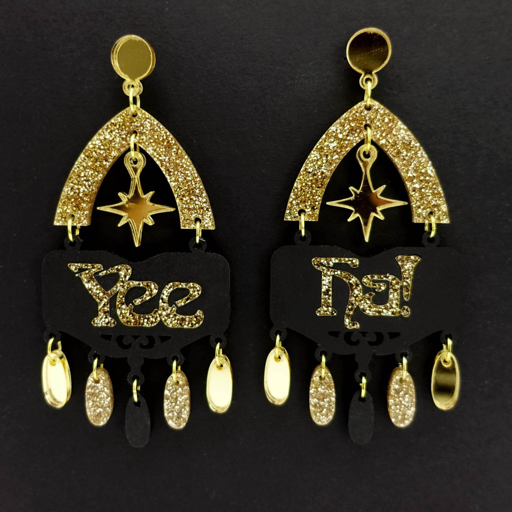 Yee Ha statement earrings in gold glitter by Wear and Resist, shown hanging side by side. 