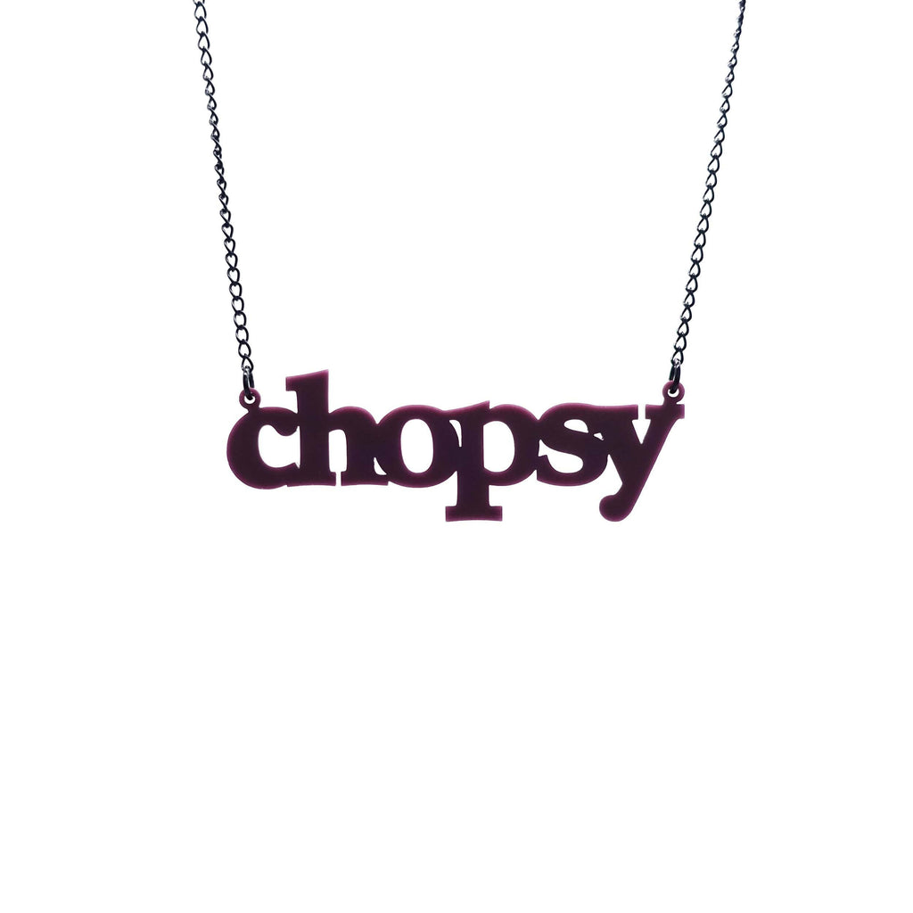 Cassis chopsy necklace shown hanging against a white background. 