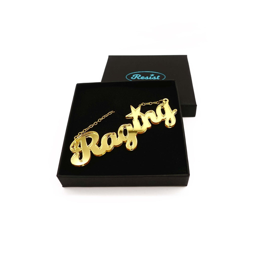 Blazing gold bling Raging necklace shown in a Wear and Resist gift box. 