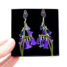 Bluebell earrings shown held up in a Wear and Resist gift box. 