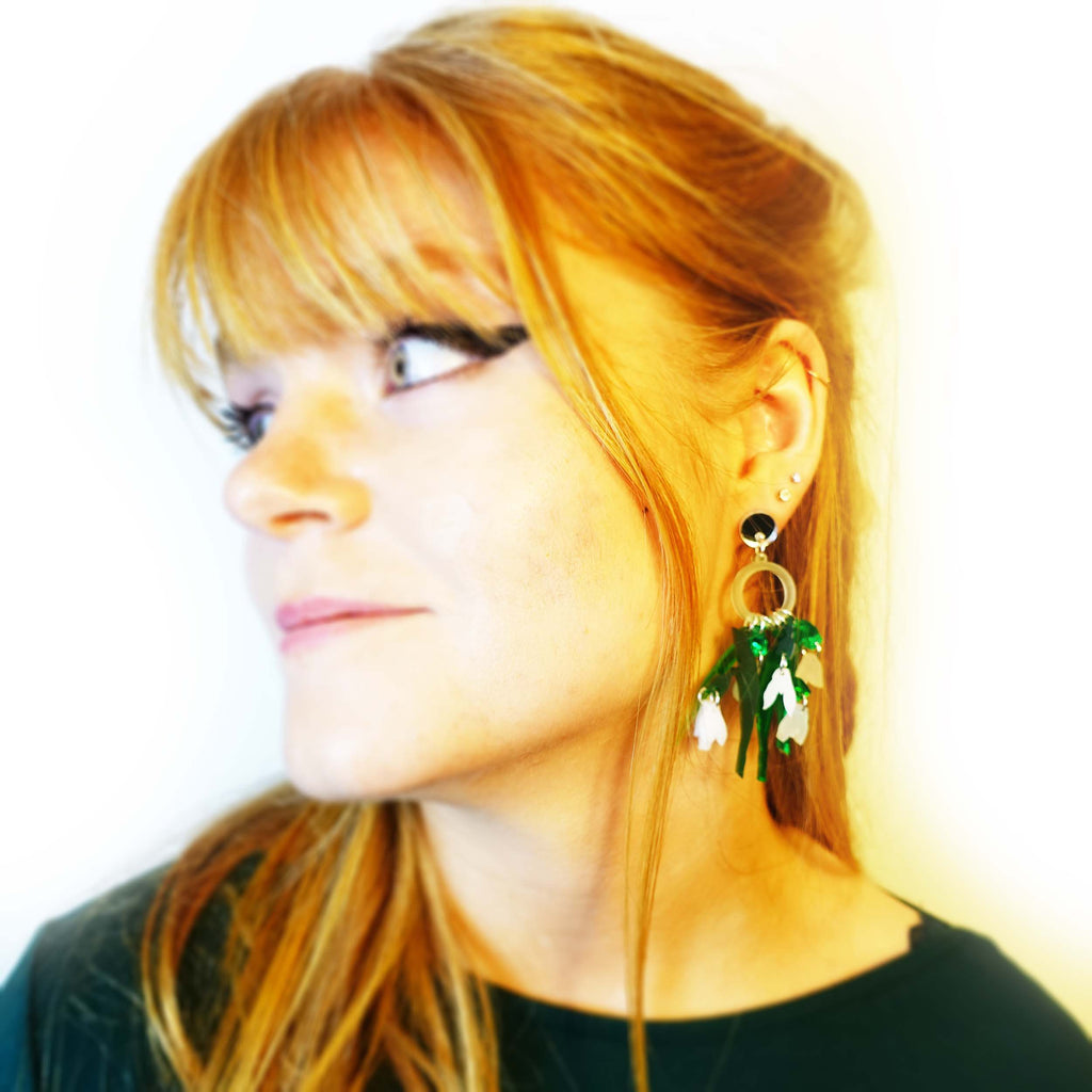 Model wears Snowdrop Earrings designed by Sarah Day for Wear and Resist. 