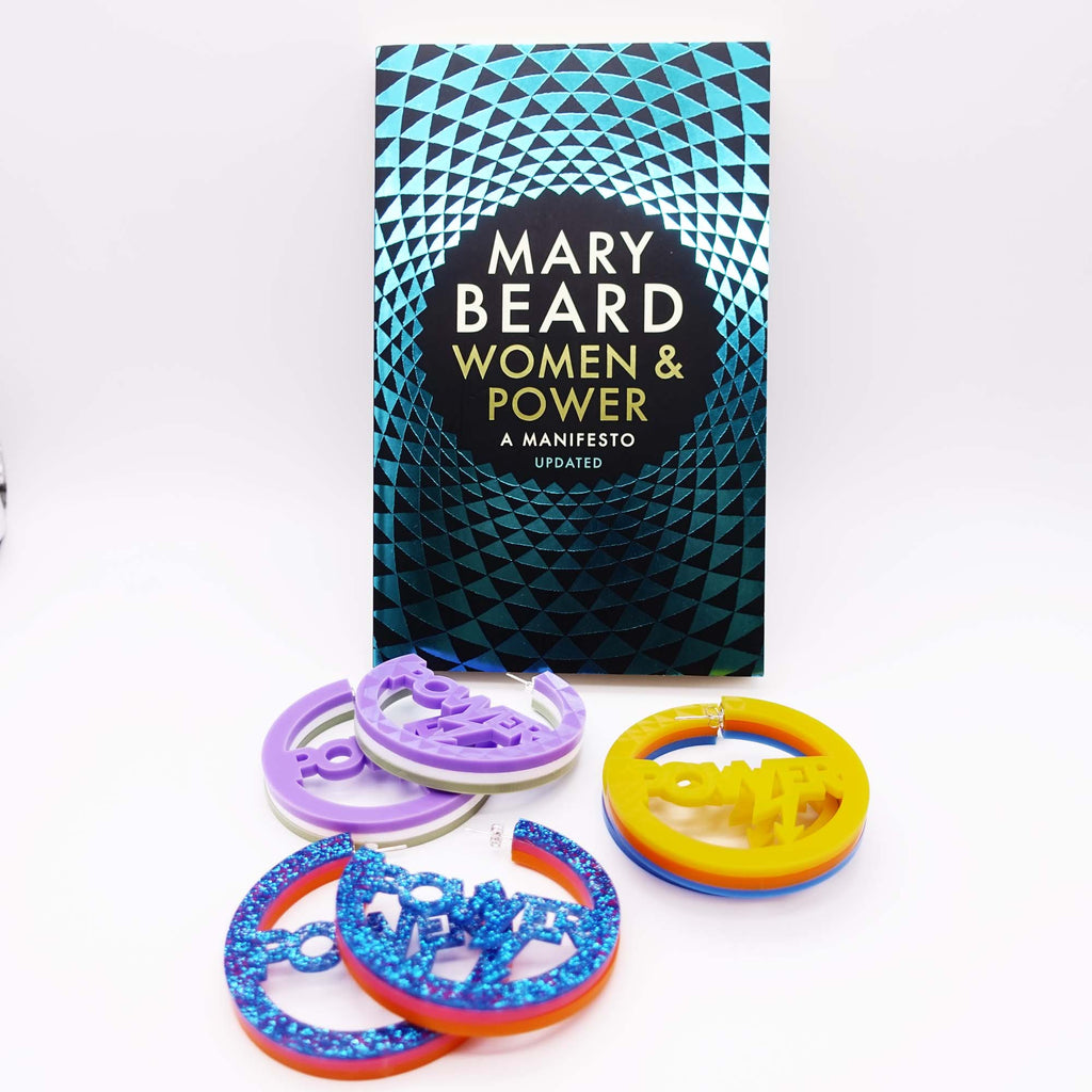 Mary Beard's updated edition of Women & Power with three pairs of  Power earrings, statement hoops