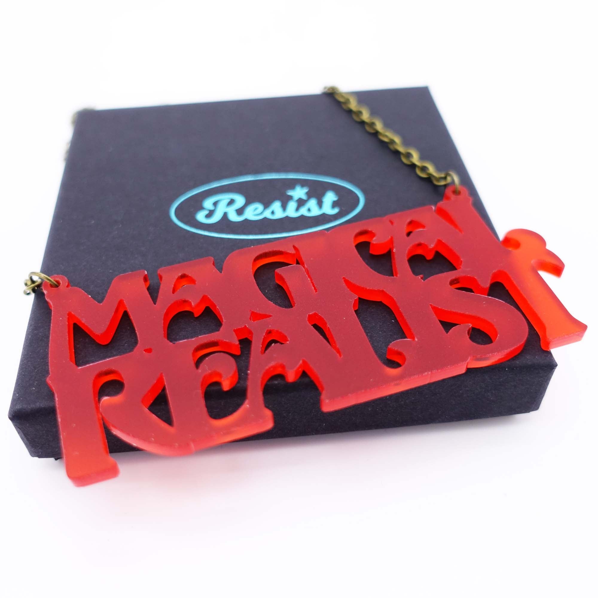chilli frost magical realist necklace for writers and book lovers shown on box
