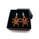 Lady Hale commemorative spider earrings in cider frost shown in box.