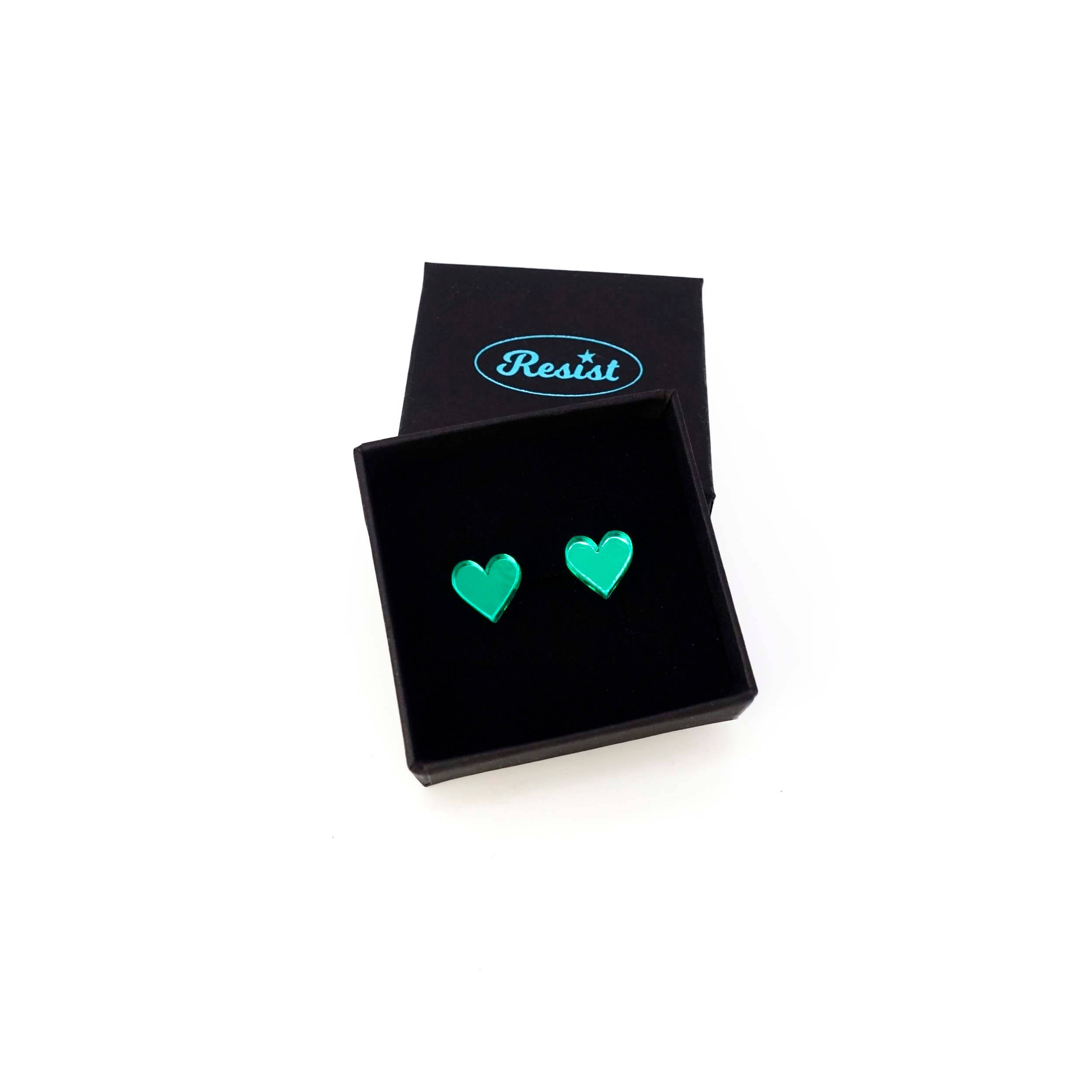 Electric green mirror tiny heart stud earrings shown in a Wear and Resist gift box. 