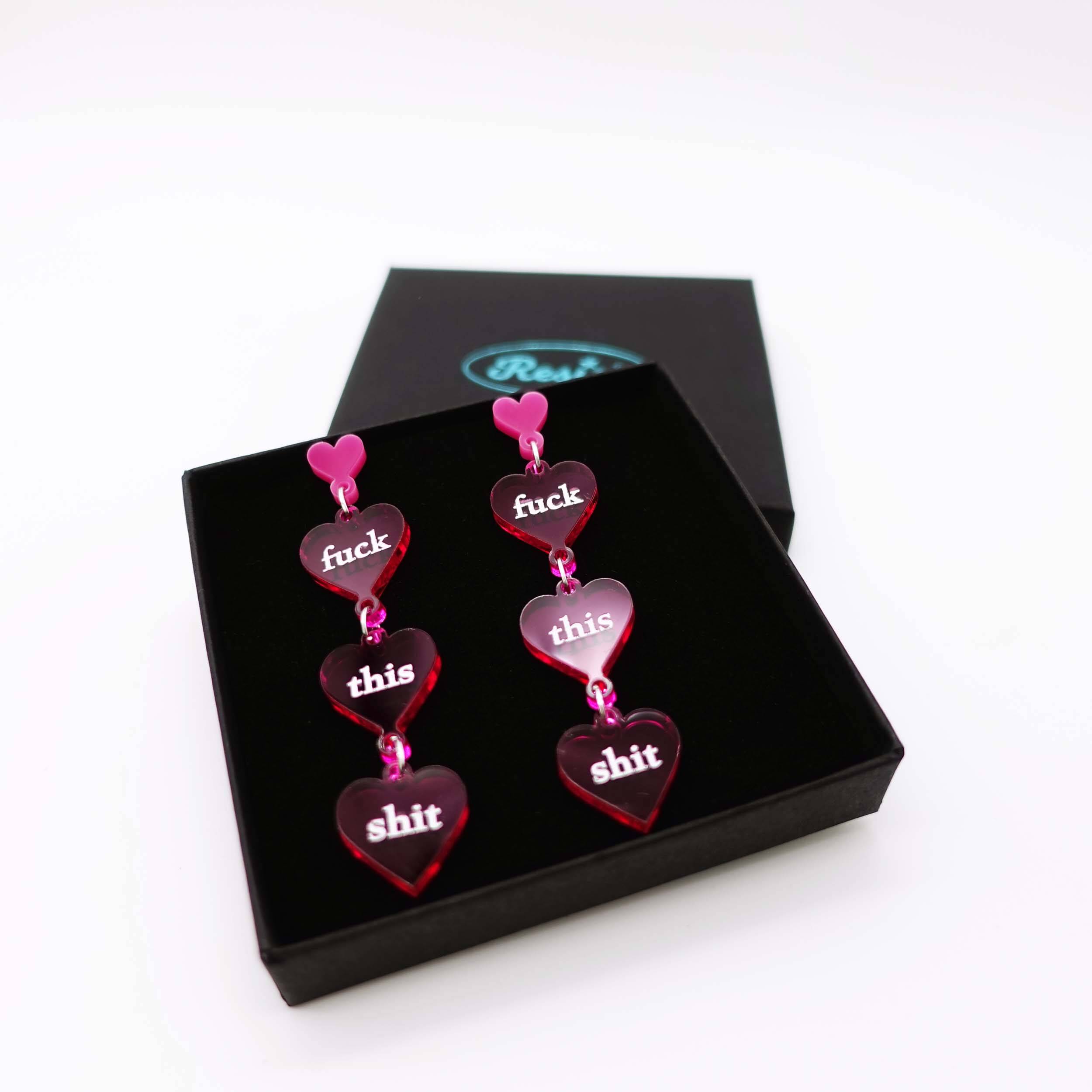 F*ck This Sh*t Valentine's earrings shown in a Wear and Resist gift box. 