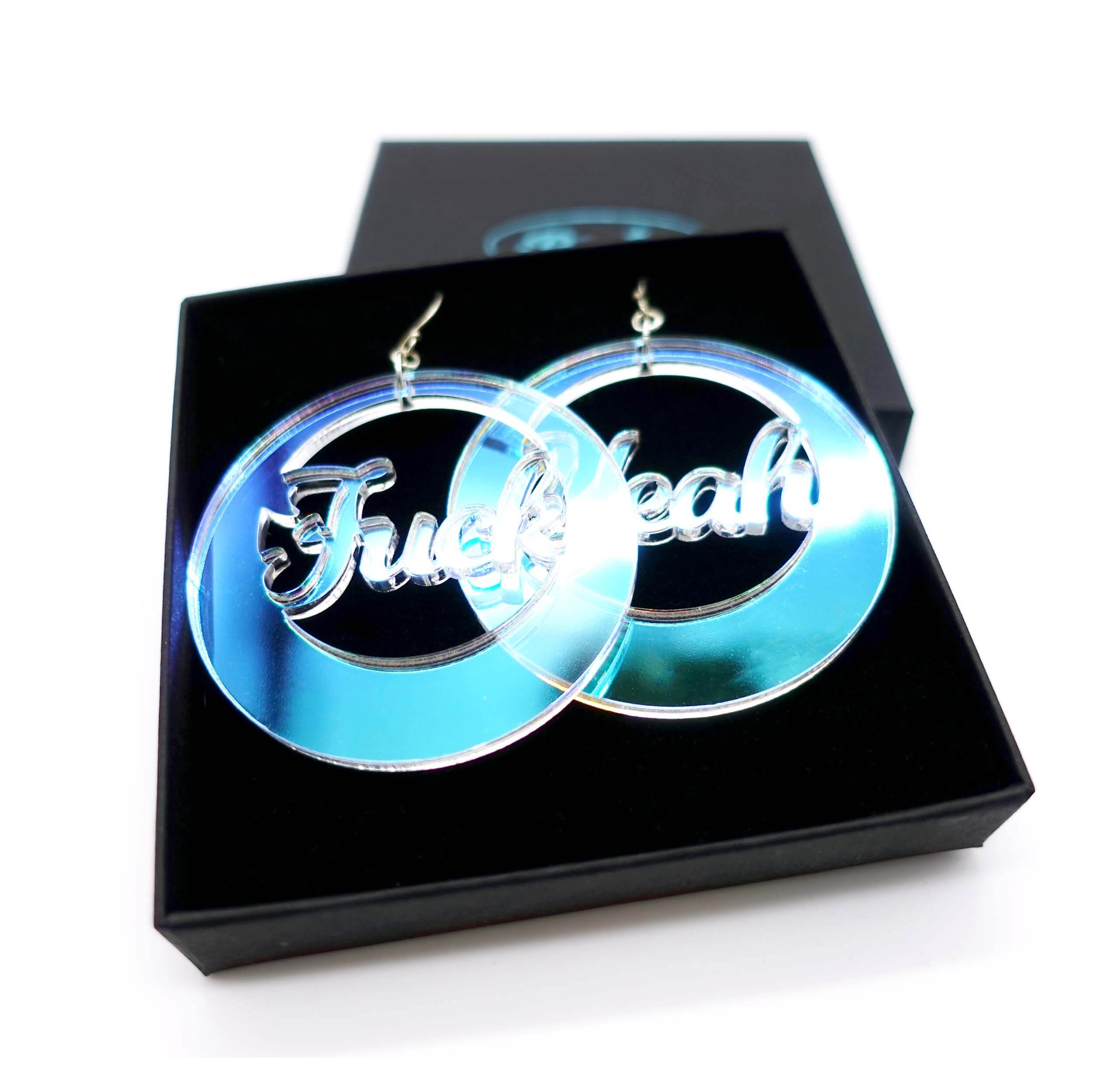 F*ck Yeah iridescent hoop earrings shown in a Wear and Resist gift box. 