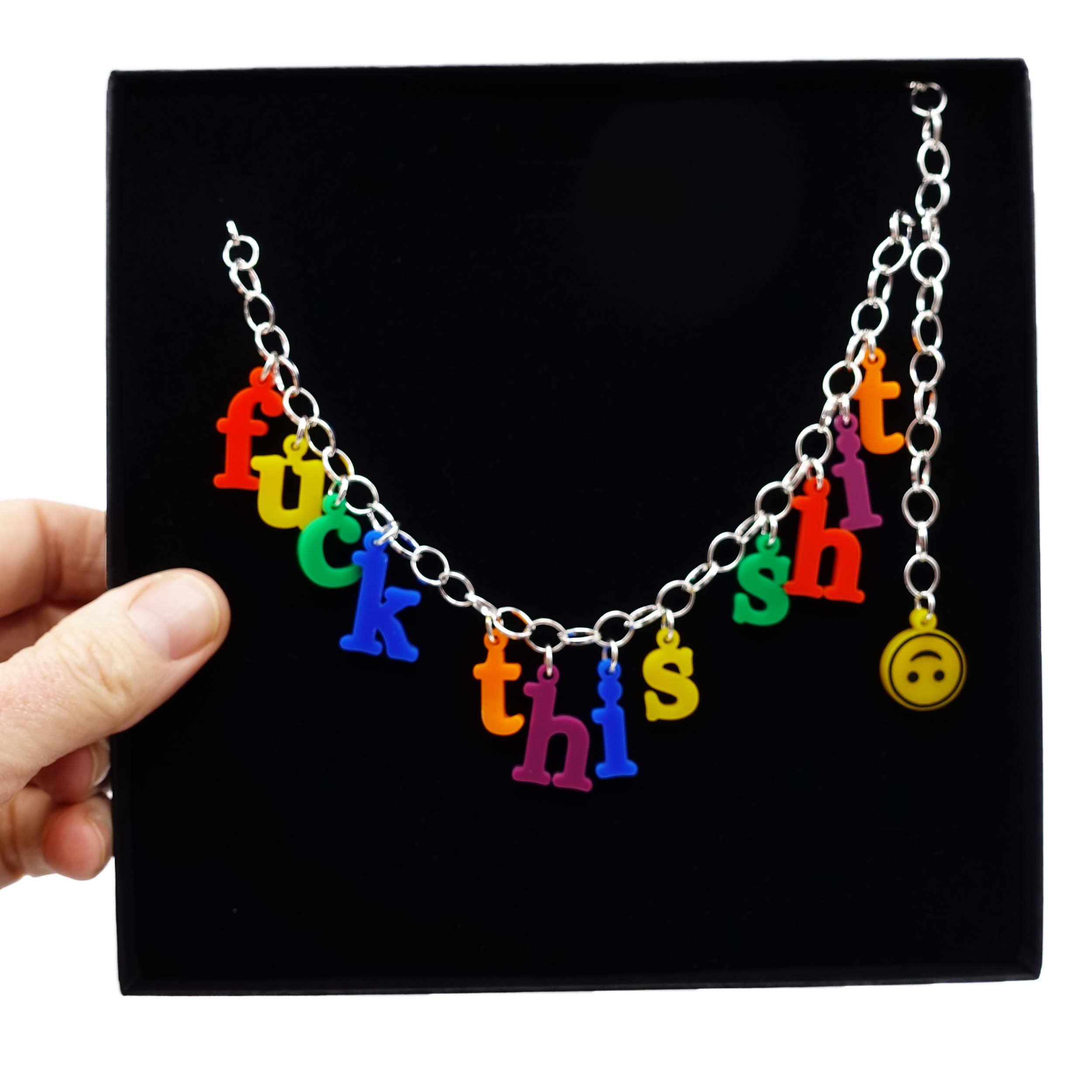 F*ck this sh*t necklace in retro alphabet letters designed by Sarah Day for Wear and Resist. Shown in a classy gift box. 