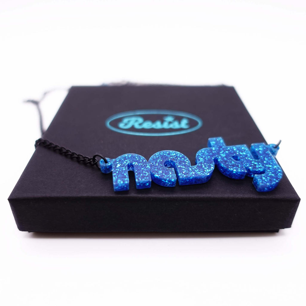 blue glitter disco nasty necklace shown on box