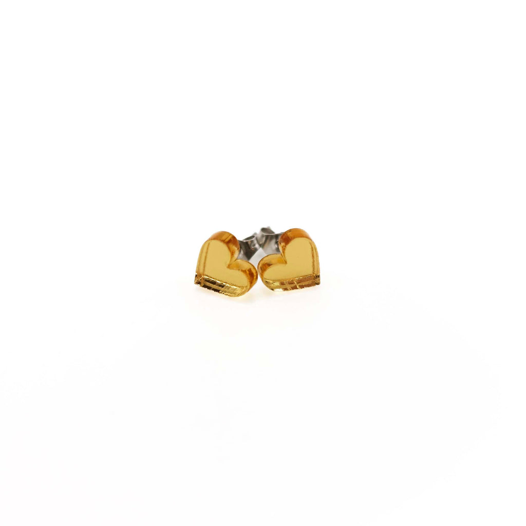 Gold mirror tiny heart stud earrings shown on a white background. 