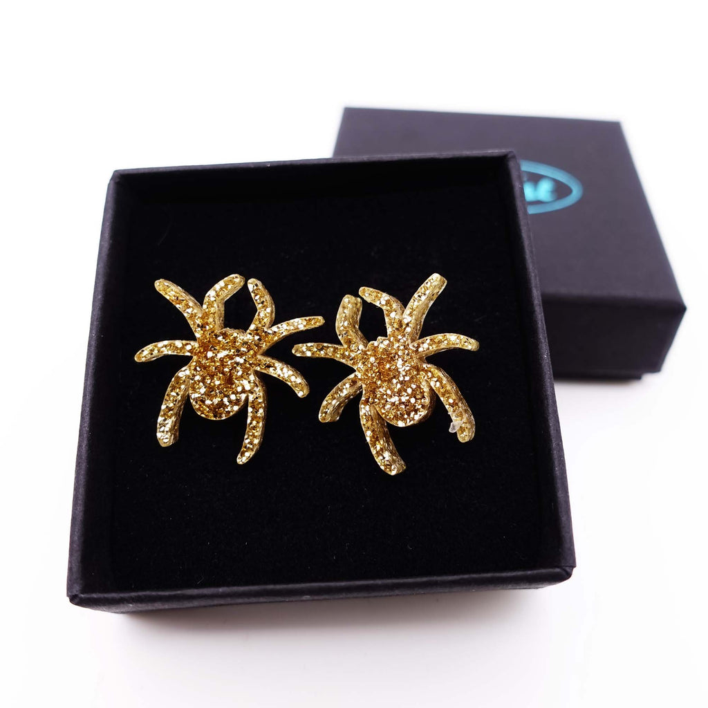 Gold glitter Lady Hale spider stud earrings by Wear and Resist. 