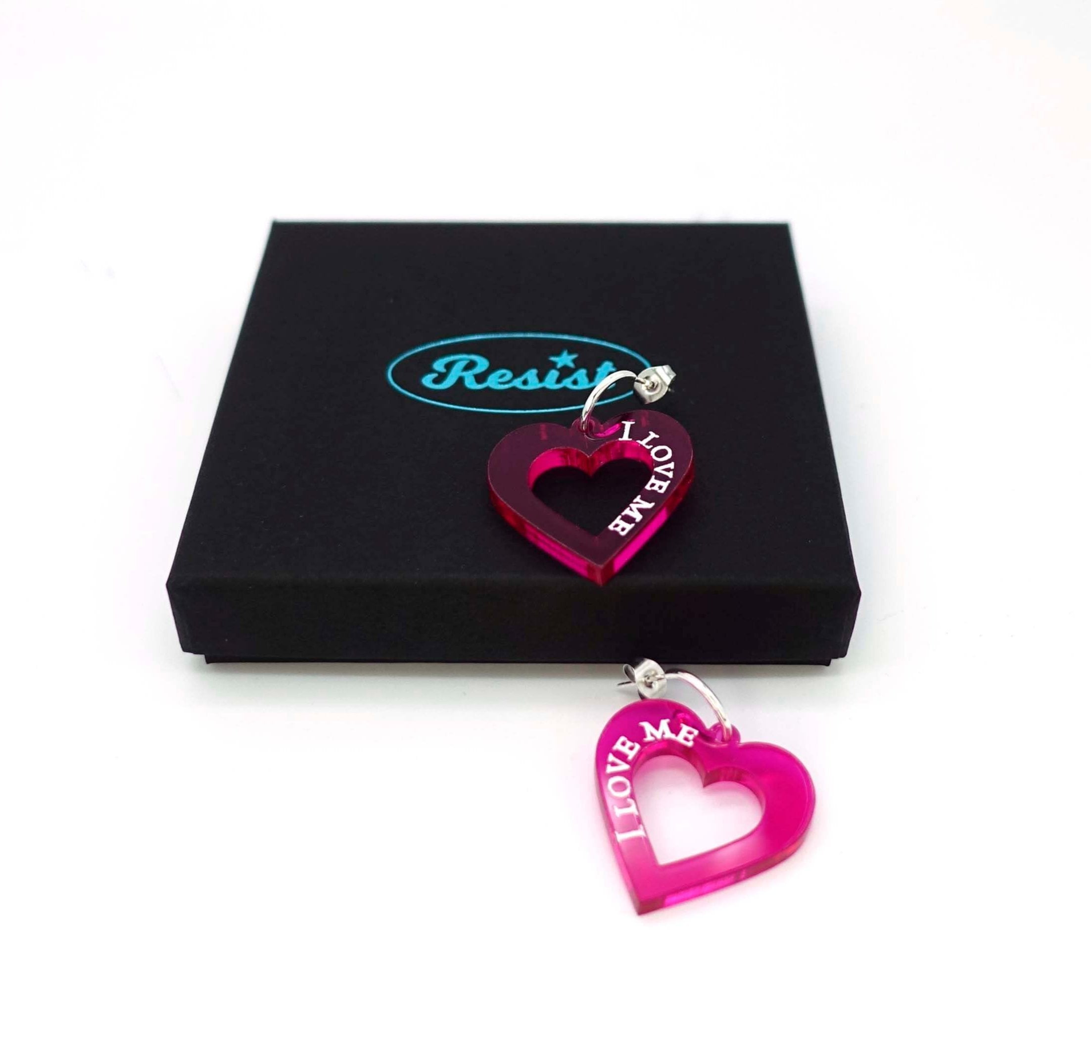 Neon pink I love me heart hoops shown with a Wear and Resist gift box.  