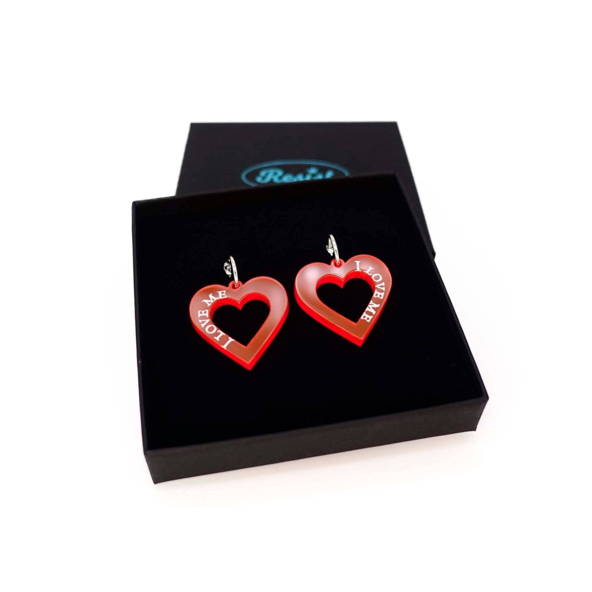 Hot red I love me heart hoops shown in a Wear and Resist gift box. 