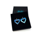 Big iridescent love heart hoop earrings shown in a Wear and Resist gift box. 