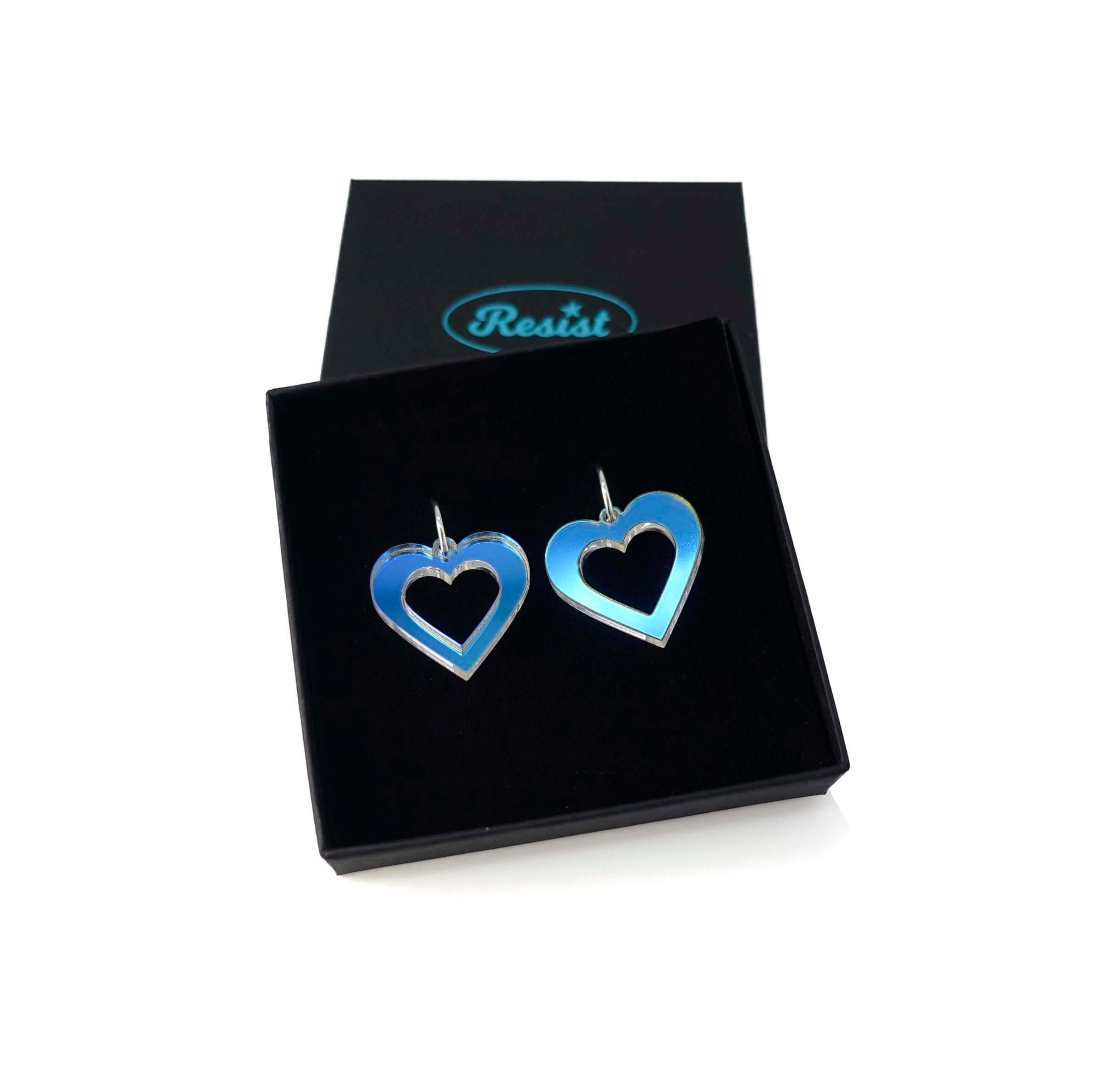 Big heart hoops in iridescent on silver hoops, shown in a Wear and Resist gift box.