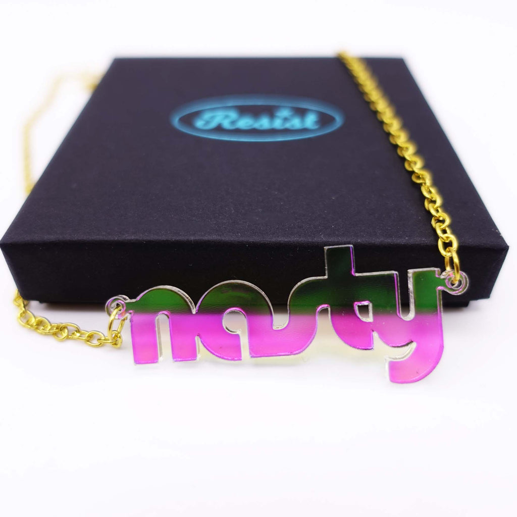 disco nasty necklace shown leaning on box