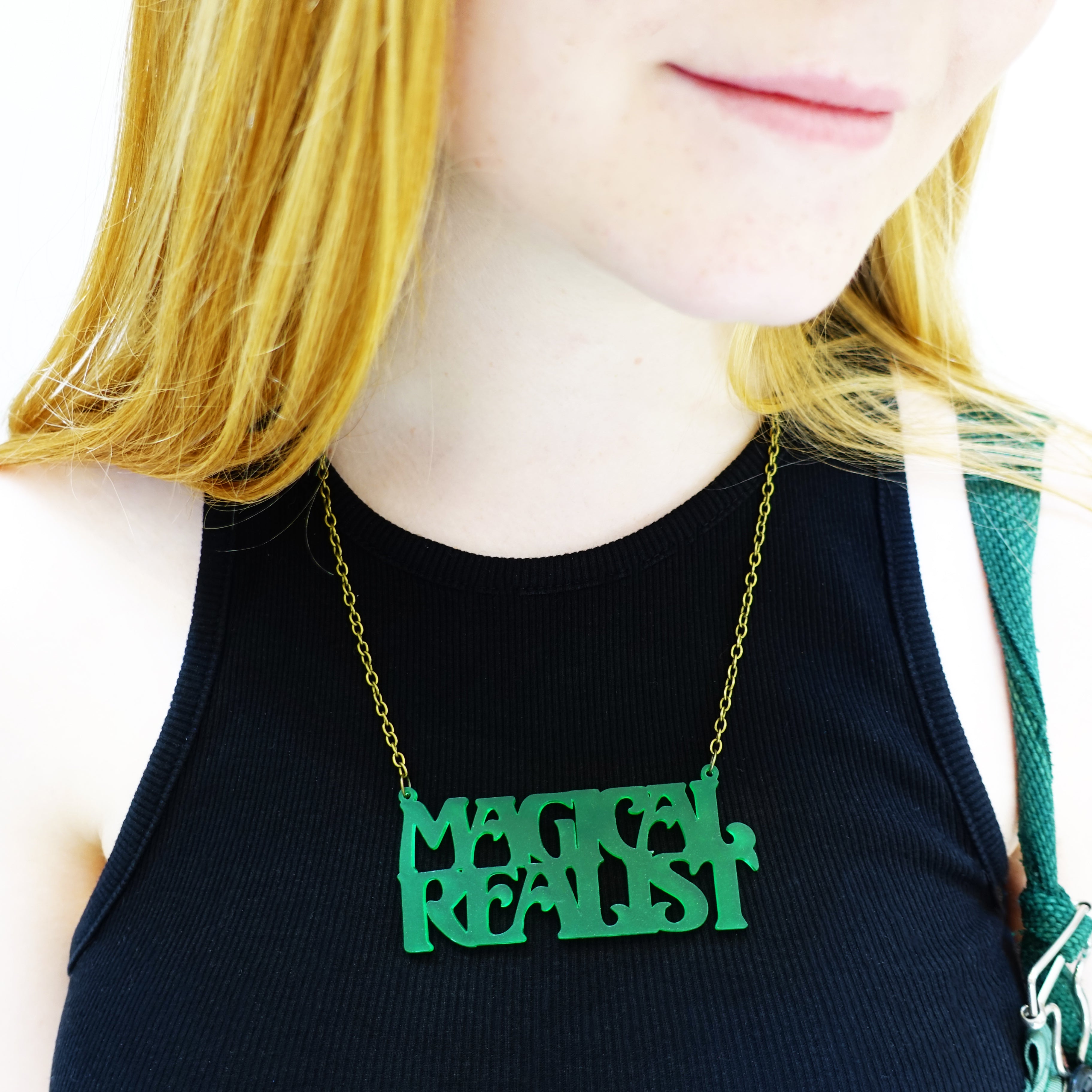 model wears leaf frost magical realist necklace for writers and book lovers