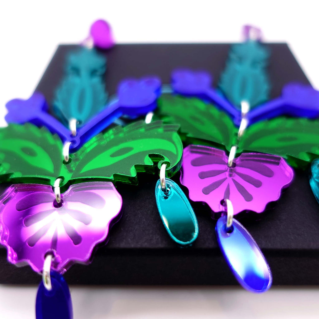 Close up of Midnight Festival earrings. Rich jewel colour statement earrings for raving and partying and festival going. 