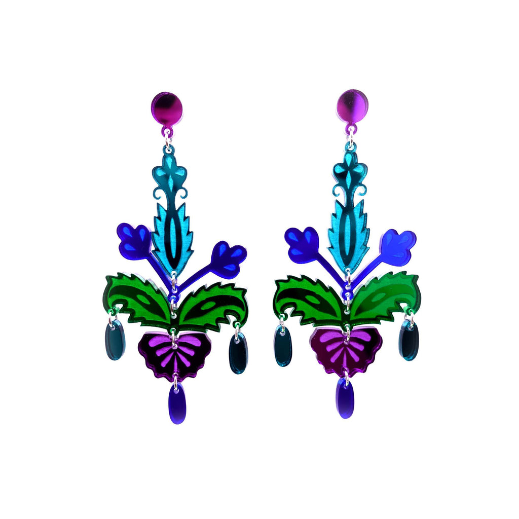 Midnight, blue, green and purple Festival statement earrings sown hanging on white. 