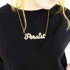 model wearing gold glitter persist necklace