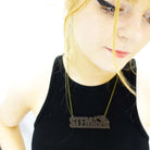 model wears tobacco frost STEMINIST necklace 