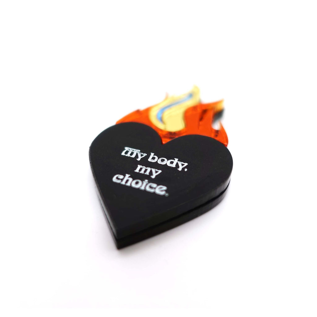 My body my choice flaming heart brooch designed by Sarah Day for Wear and Resist. 
