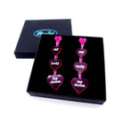 My body my choice heart drop earrings shown in a Wear and Resist gift box. 