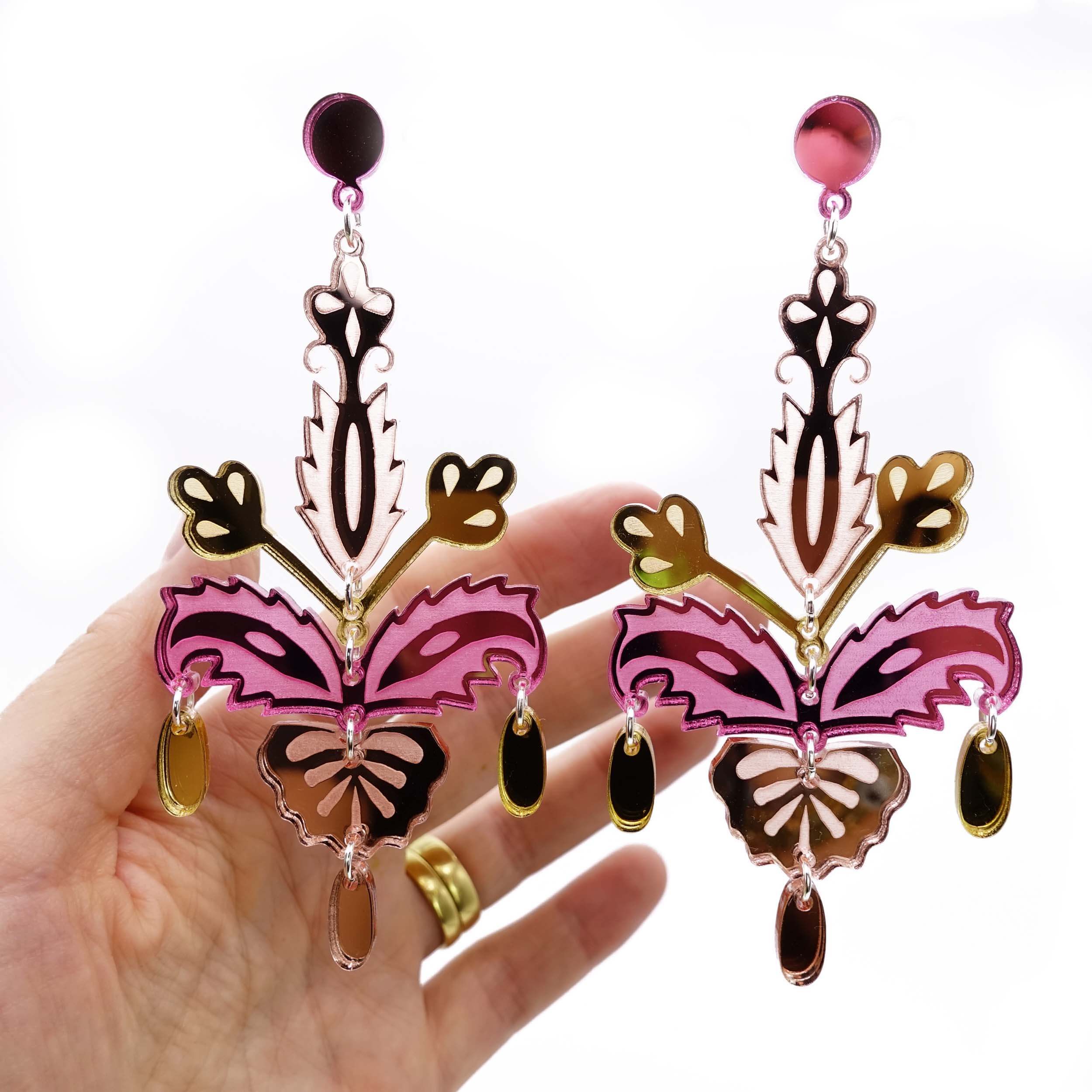 Rose pink and gold Festival drop dangly earrings for going out in the sunshine with friends. Shiny, eye-catching big statement earrings for partying in the sun, designed by Sarah Day for Wear and Resist. 