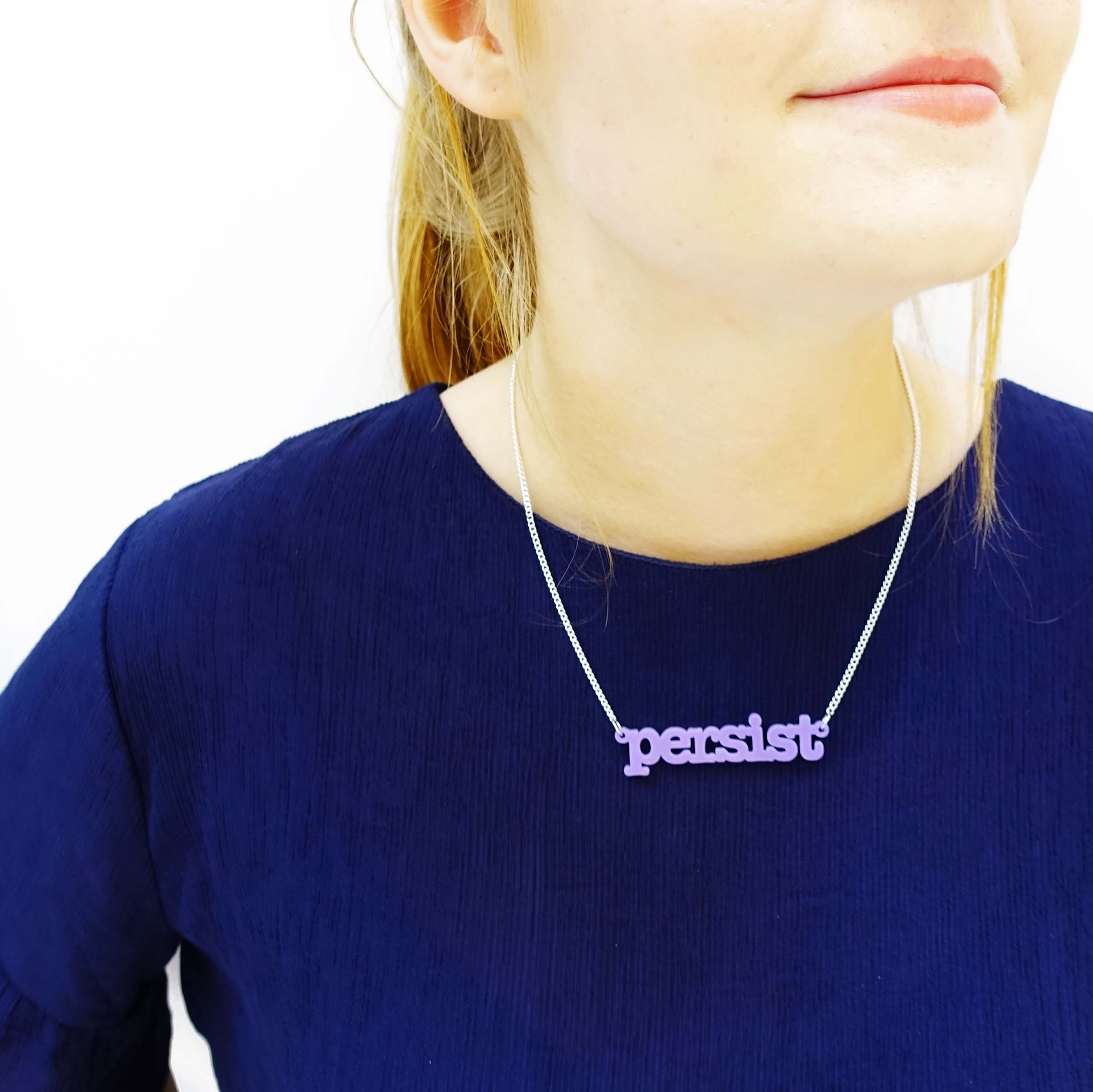 Model wears a Parma violet Persist necklace.