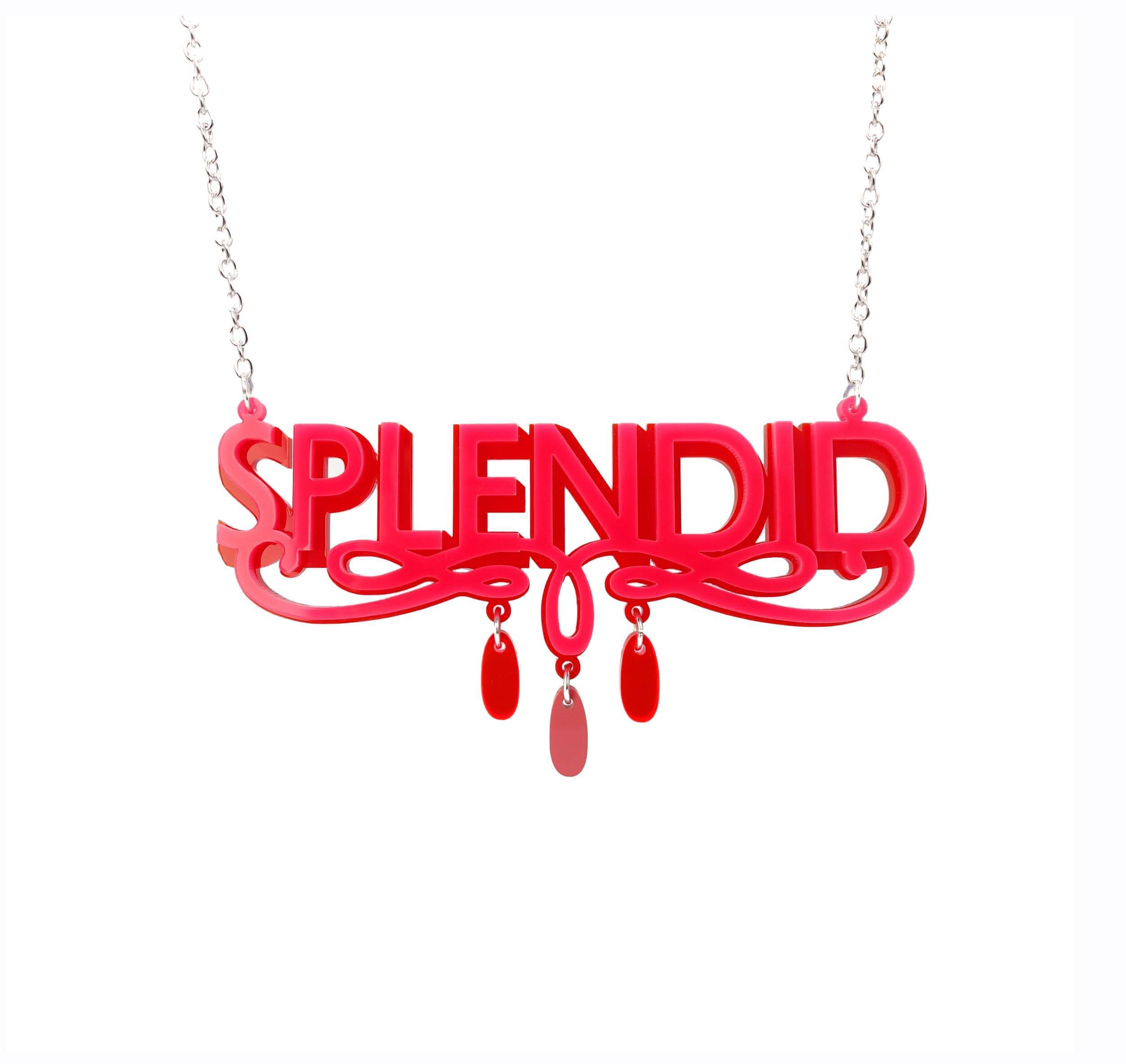 Hot pink and red Splendid necklace shown hanging against a white background. 