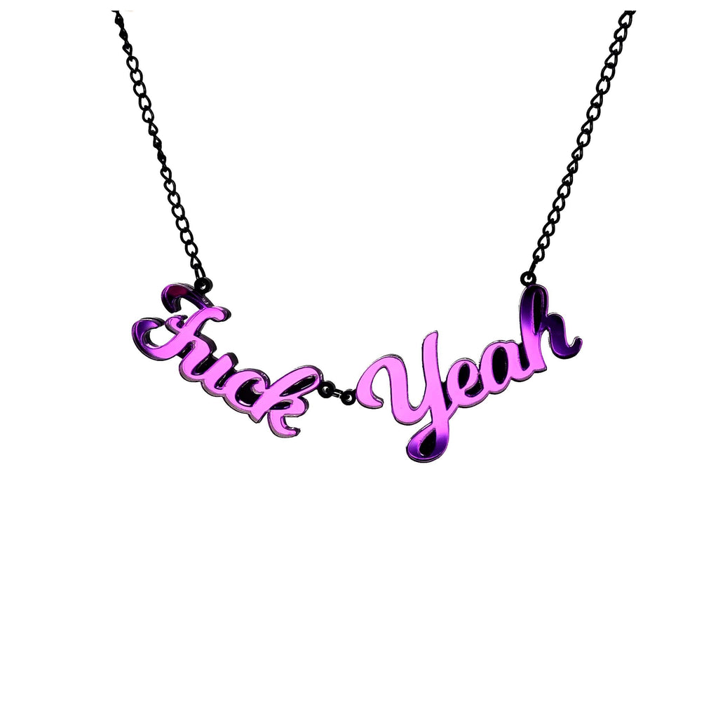 Poison purple mirror F*ck Yeah necklace shown hanging on white. Designed by Sarah Day for Wear and Resist. £2 goes to Bloody Good Period. 