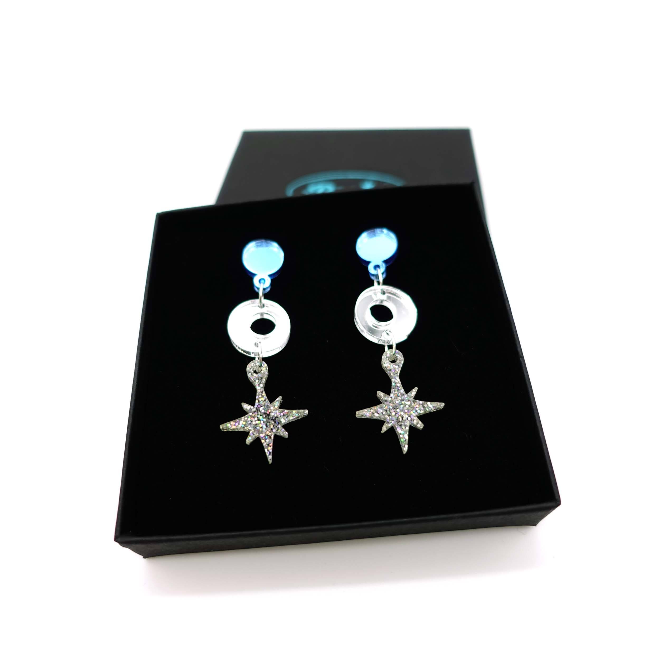 Cool silver Deco Star earrings shown in a Wear and Resist gift box. 