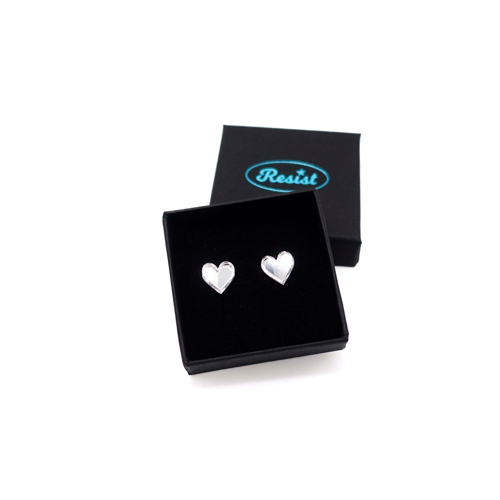 Silver mirror tiny heart stud earrings shown in a Wear and Resist gift box. 