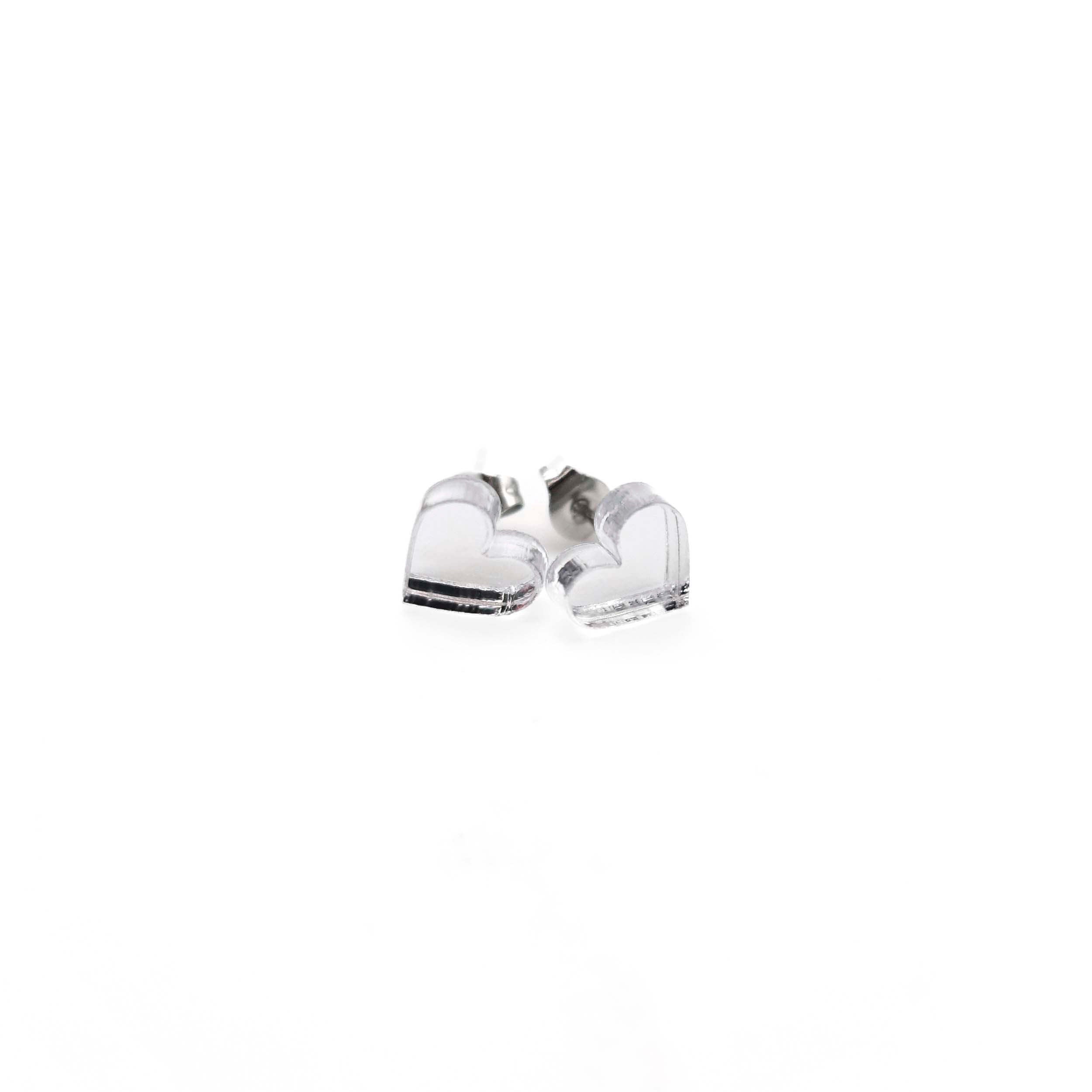 Silver mirror tiny heart stud earrings shown on a white background. 