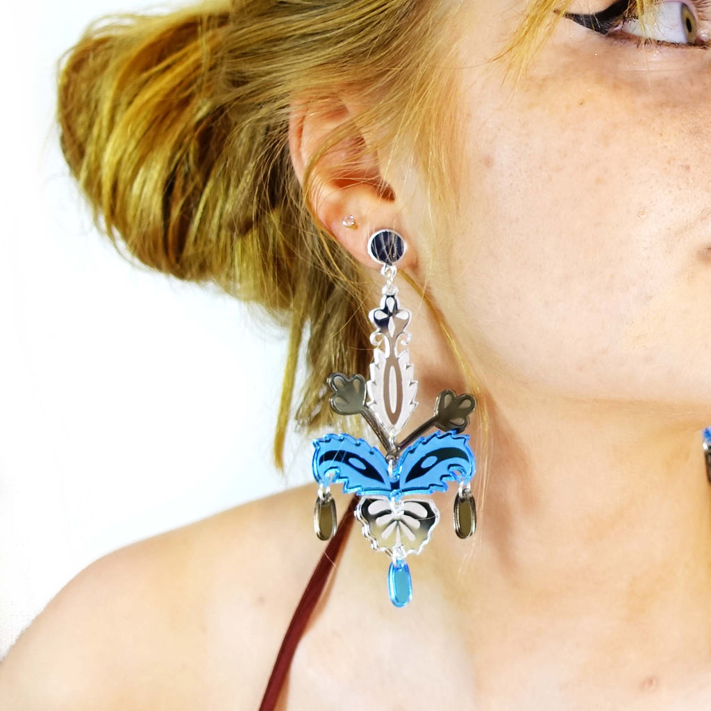 Model wears Sky festival statement earrings. Perfect earrings for festivals, raves or parties! 