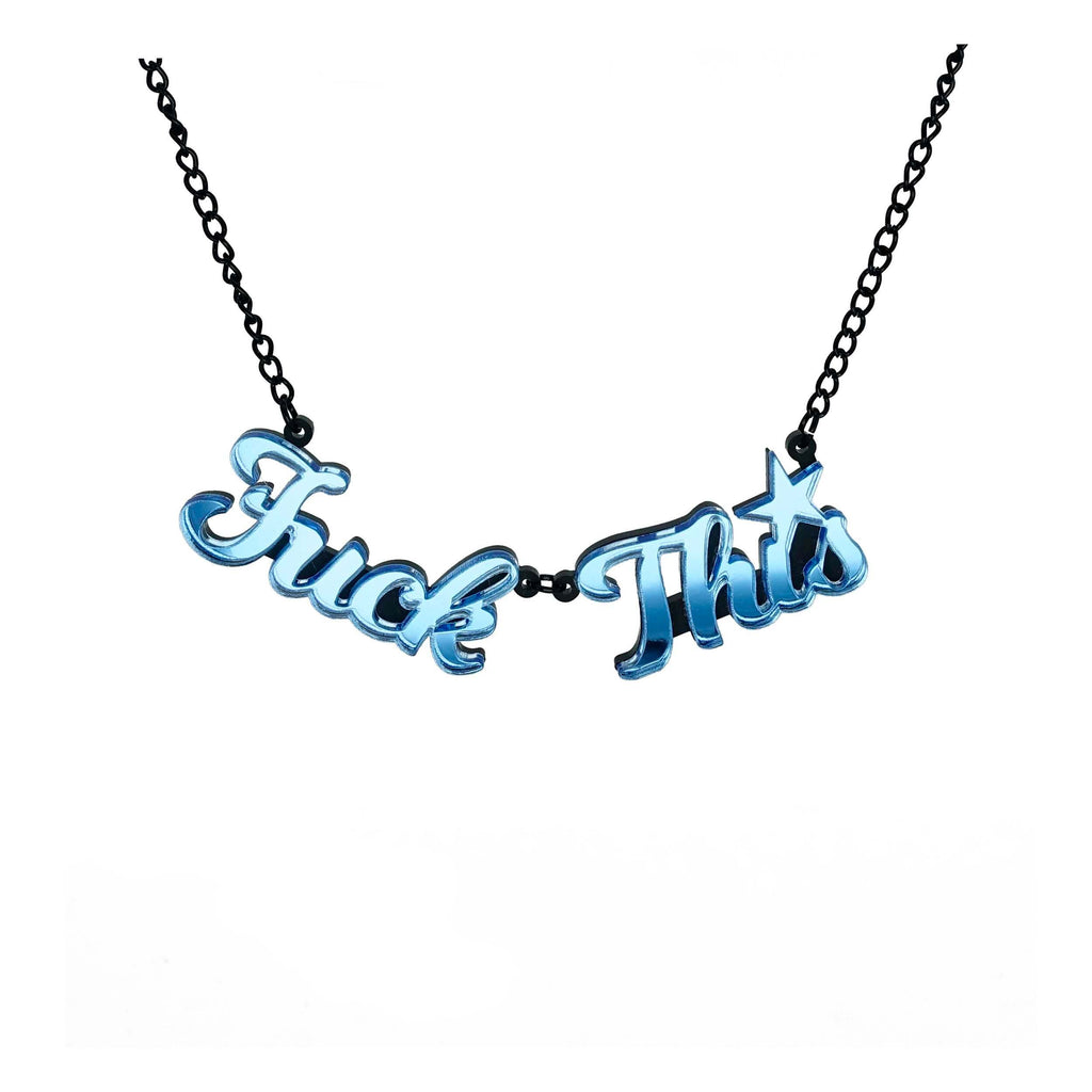 A Sky blue mirror F*ck This necklace shown hanging against a white background. Designed by Sarah Day for Wear and Resist. £2 goes to Bloody Good Period. 