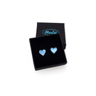 Sky mirror tiny heart stud earrings shown in a Wear and Resist gift box. 