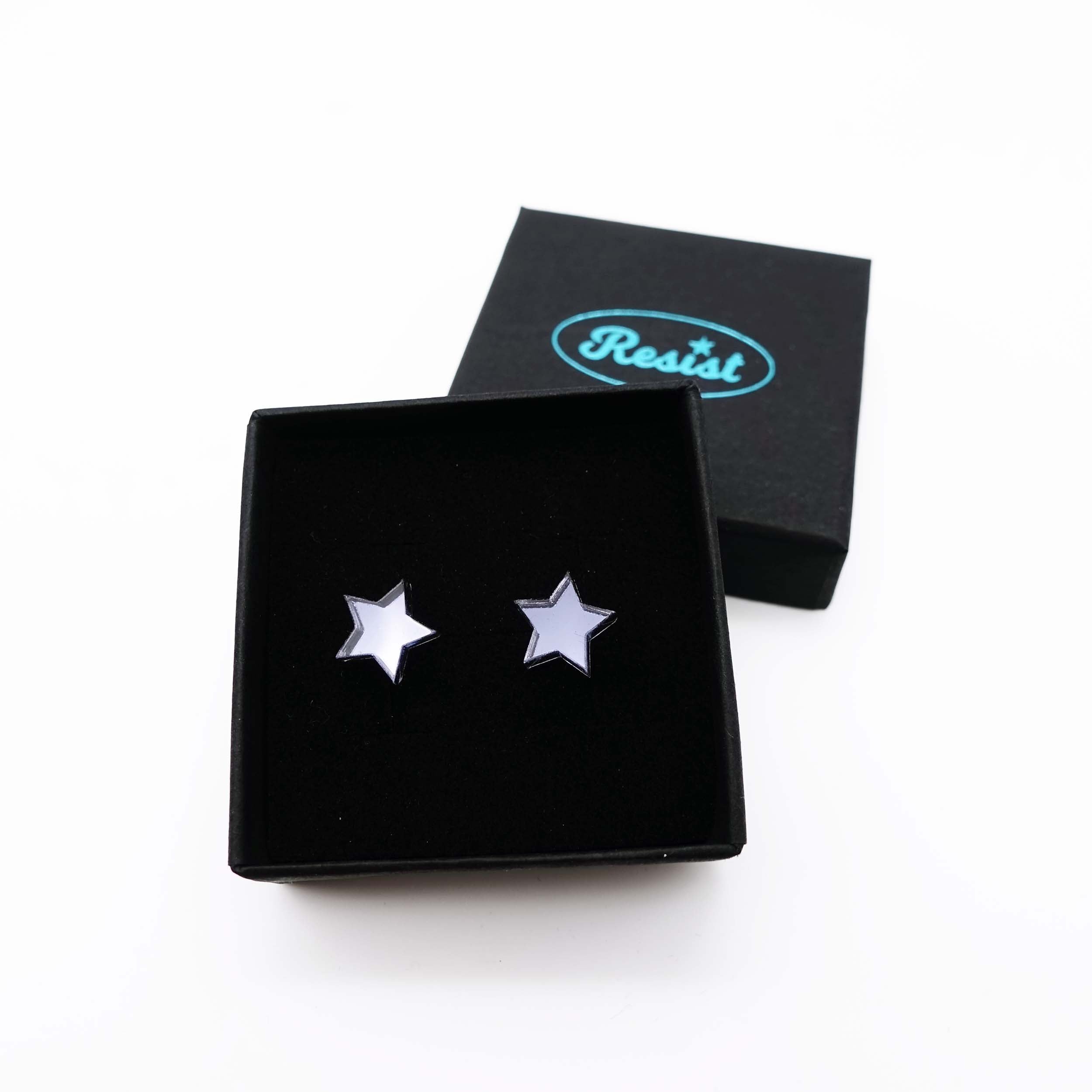 Slate mirror star stud earrings shown in box. 