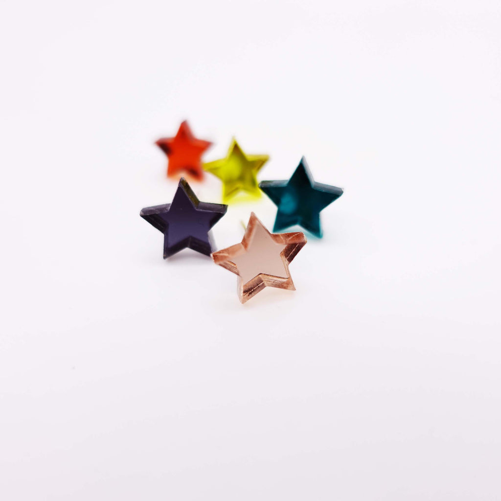 group shot showing one each of mirror small star earrings