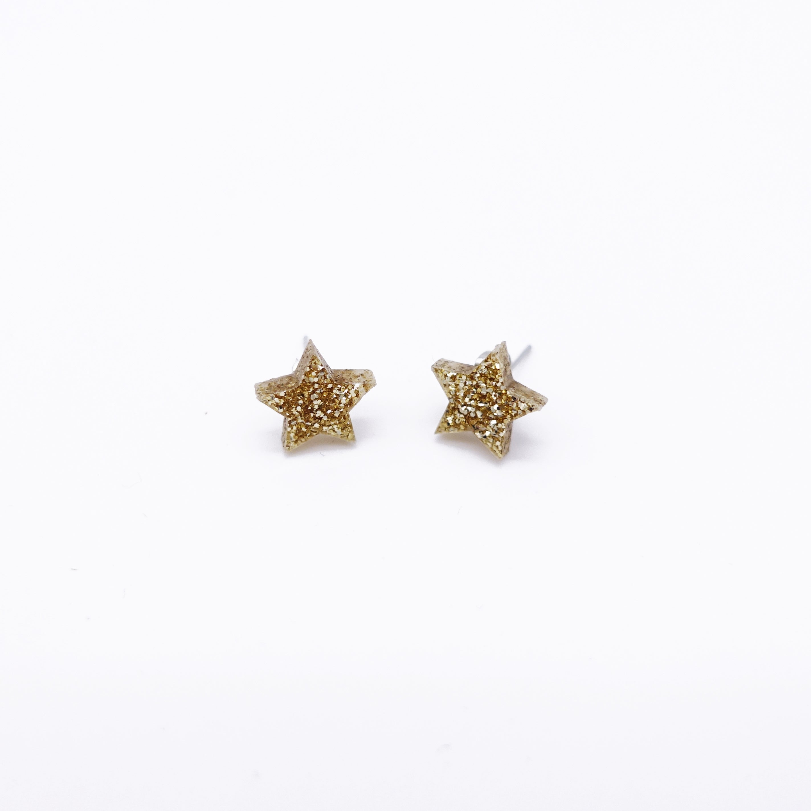 gold glitter small star earrings