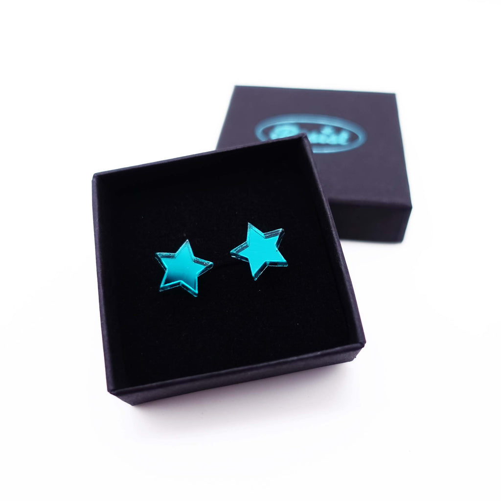 Teal mirror star stud earrings shown in box. 