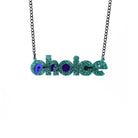 Teal glitter and indigo mirror Pro-choice necklace, shown hanging on black chain, designed by Sarah Day for Wear and Resist. £2 goes to Alliance for Choice who campaign  for Free, Safe and Legal abortions for anyone who needs them. 