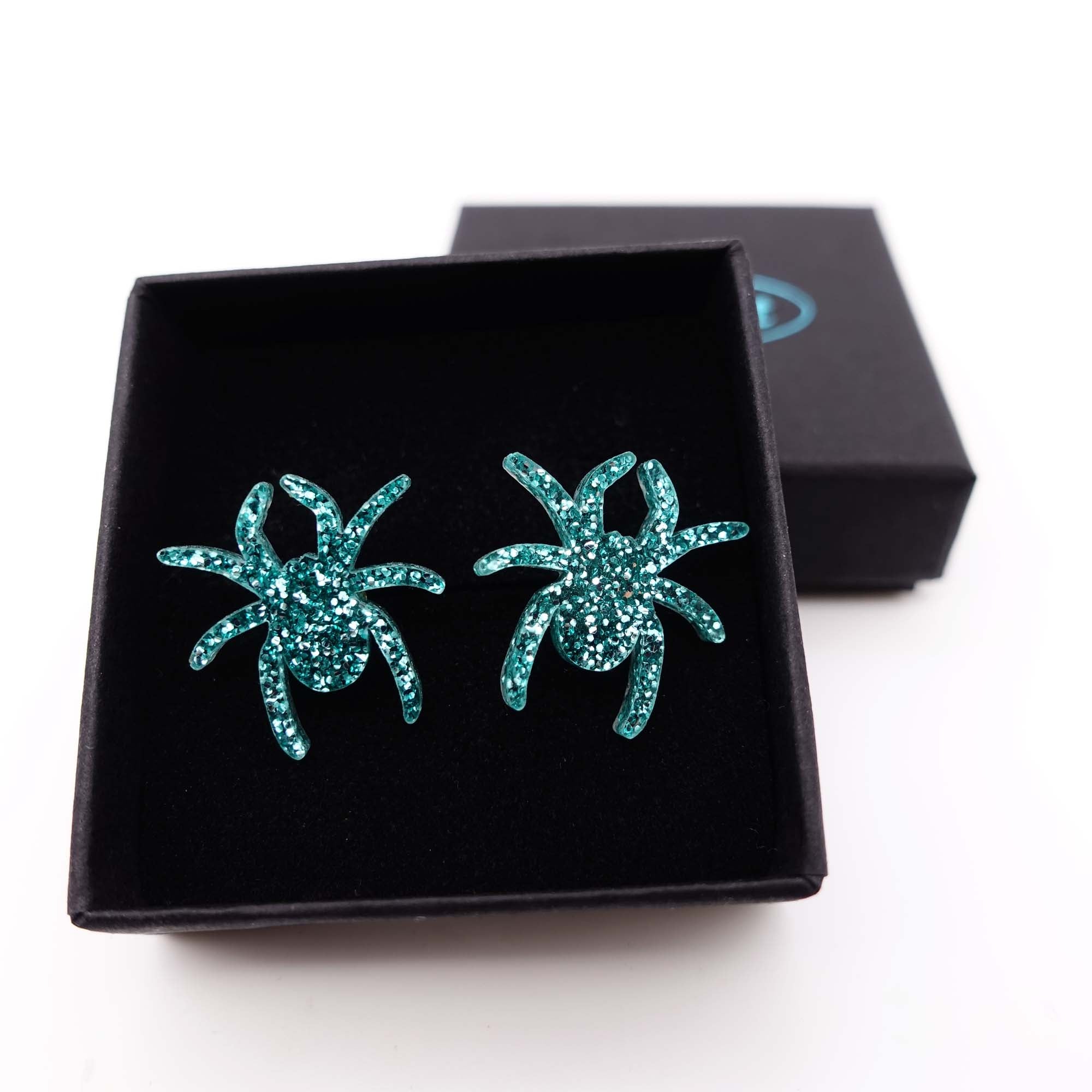 Teal glitter Lady Hale spider stud earrings by Wear and Resist. 
