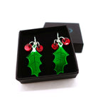 Delicate Holly earrings designed by Sarah Day shown in a Wear and Resist gift box. 