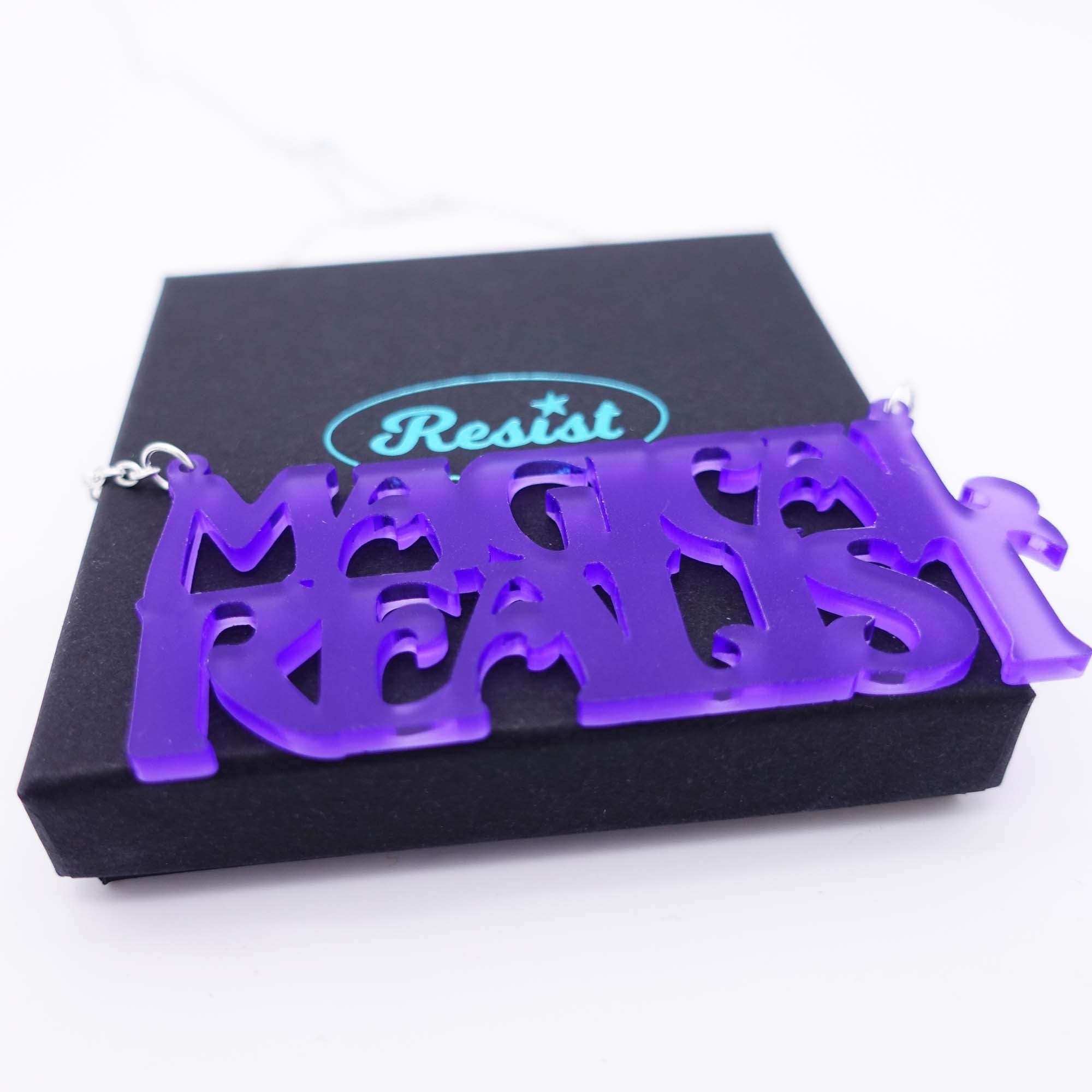 violet frost magical realist necklace for writers and book lovers shown on box
